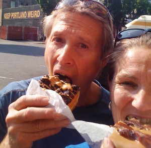 Image of couple eating Voodoo Doughnuts and keeping Portland weird