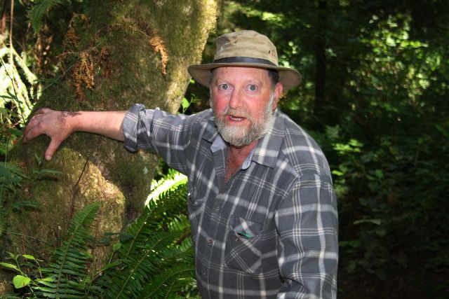 Forester Elliott Menashe in the woods on Whidbey Island