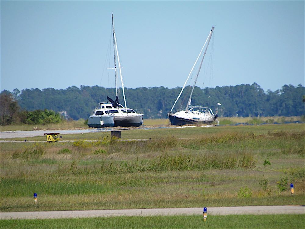 hurricane matthew leaves sailboats on airport runway