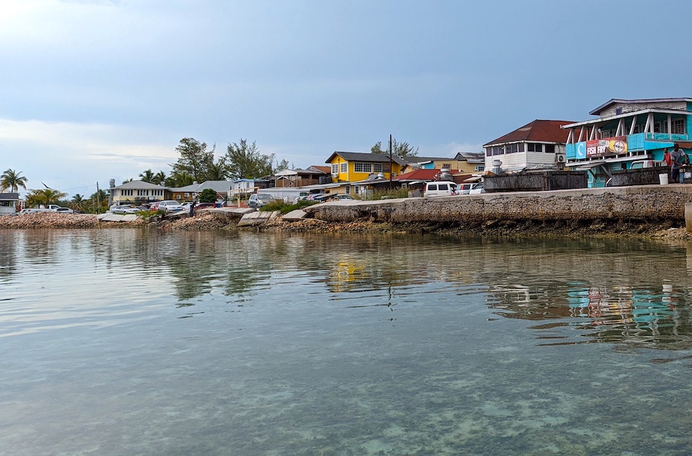 Conch piles line the water side of restaurants Fish Fry Street Nassau Bahamas.