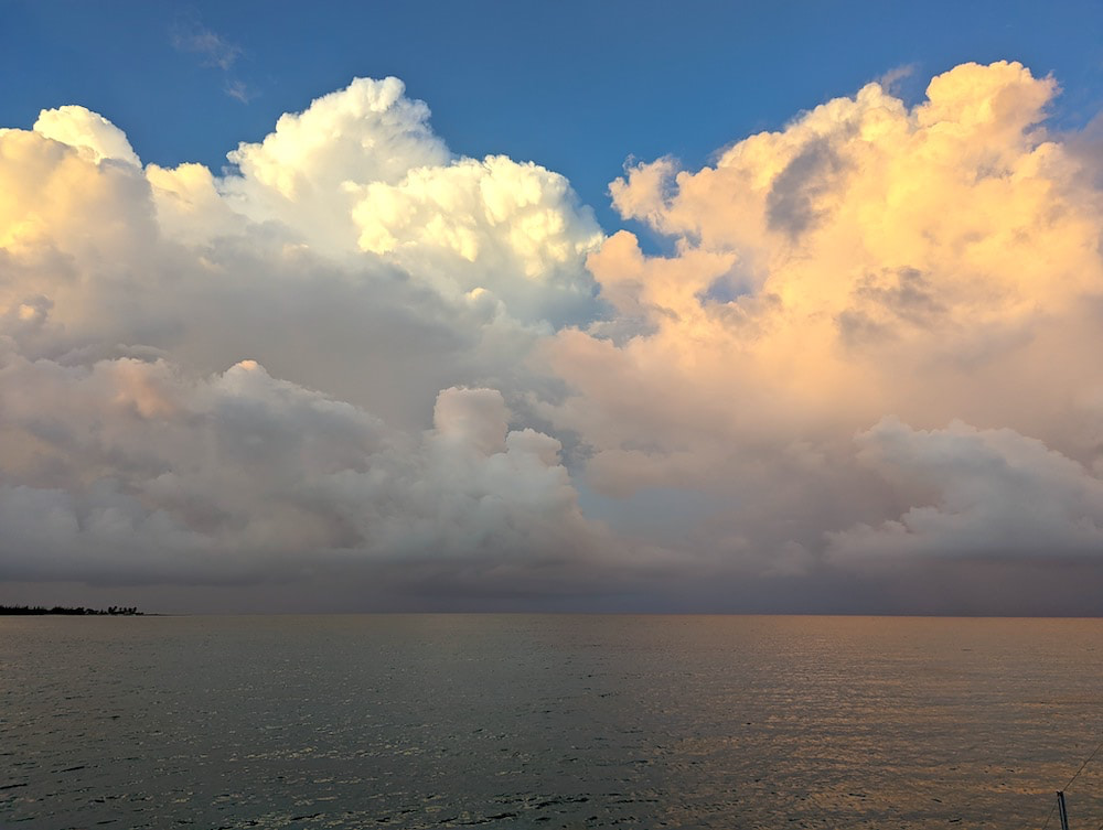 puffy peach colored clouds at sunset, Acklin's Island, one of the Bahamas Out Islands
