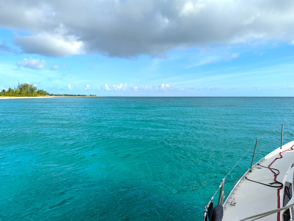 a sailboat at anchor in calm turquoise water off Landrail Point, Crooked Island, one of the Out Islands of the Bahamas